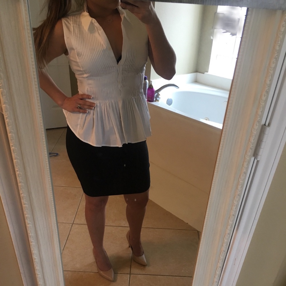 NWT- Sleeveless white blouse.